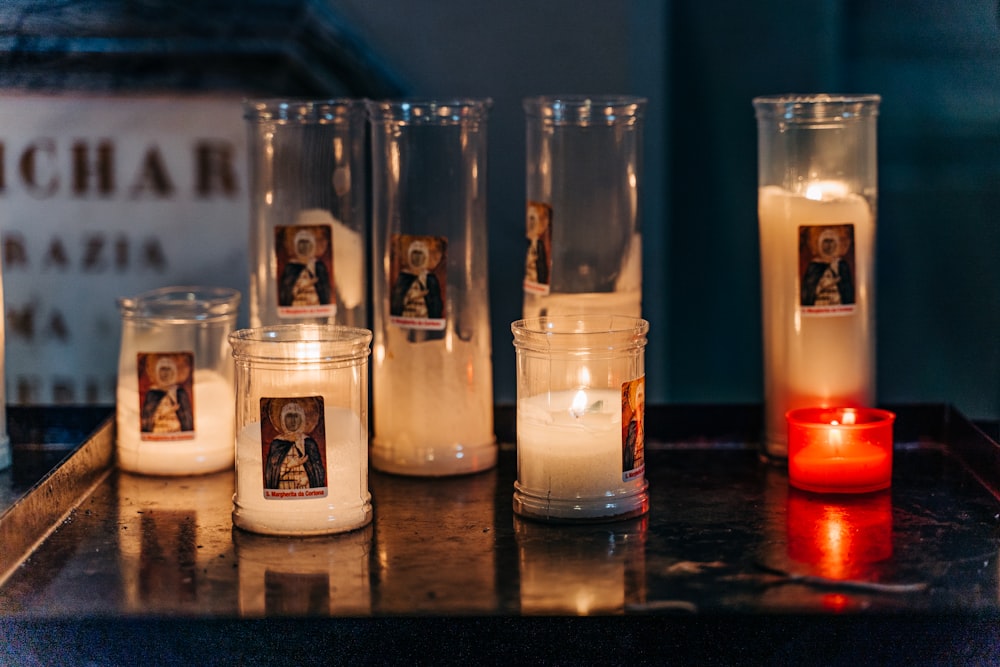 white candles on brown wooden table