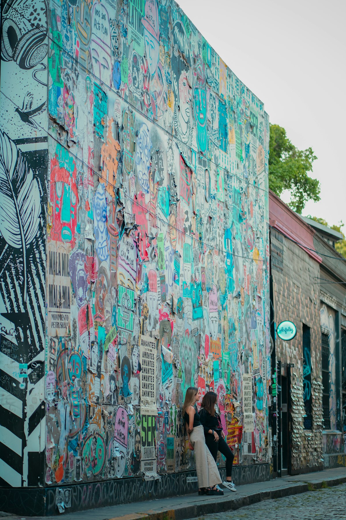 Palermo Buenos Aires — tree-lined street with colourful buildings and outdoor café tables