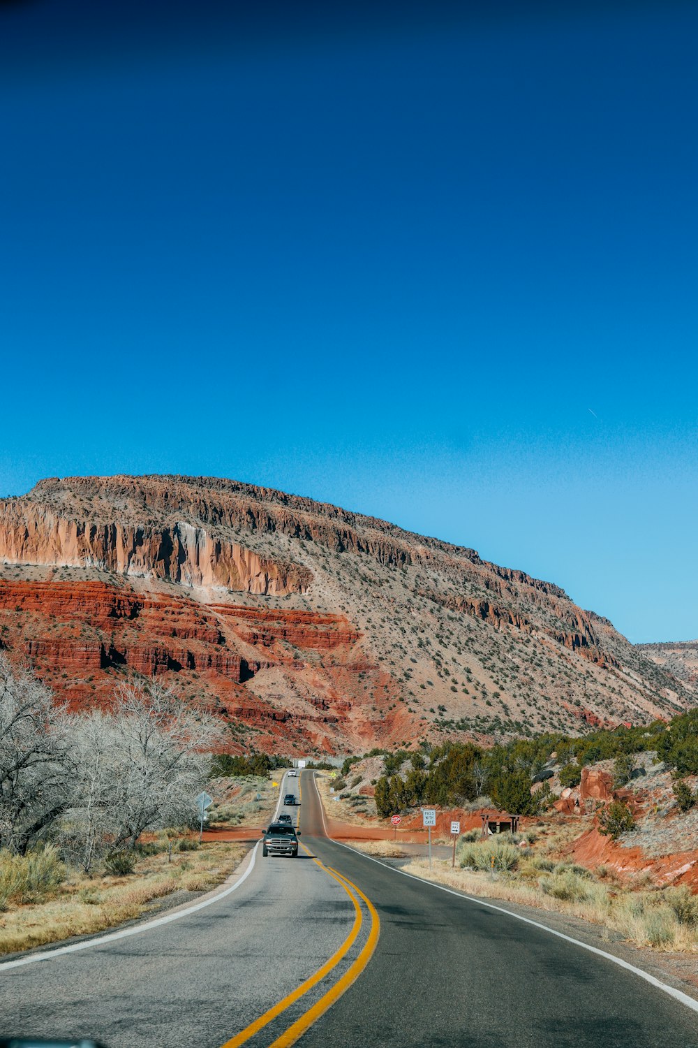 brown rocky mountain under blue sky during daytime