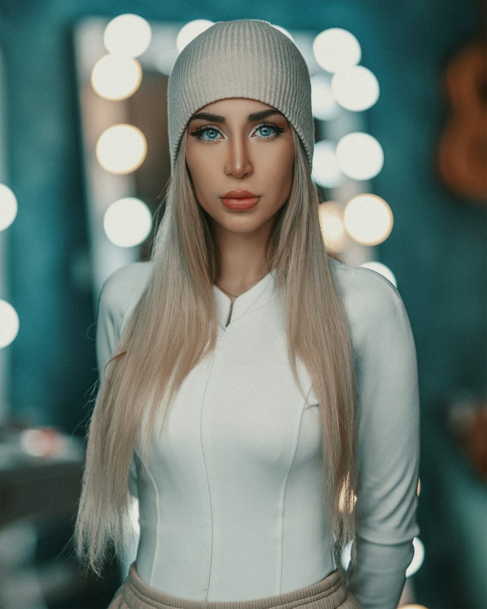 woman in white knit cap and white long sleeve shirt