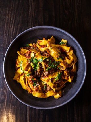 pasta dish on black ceramic bowl