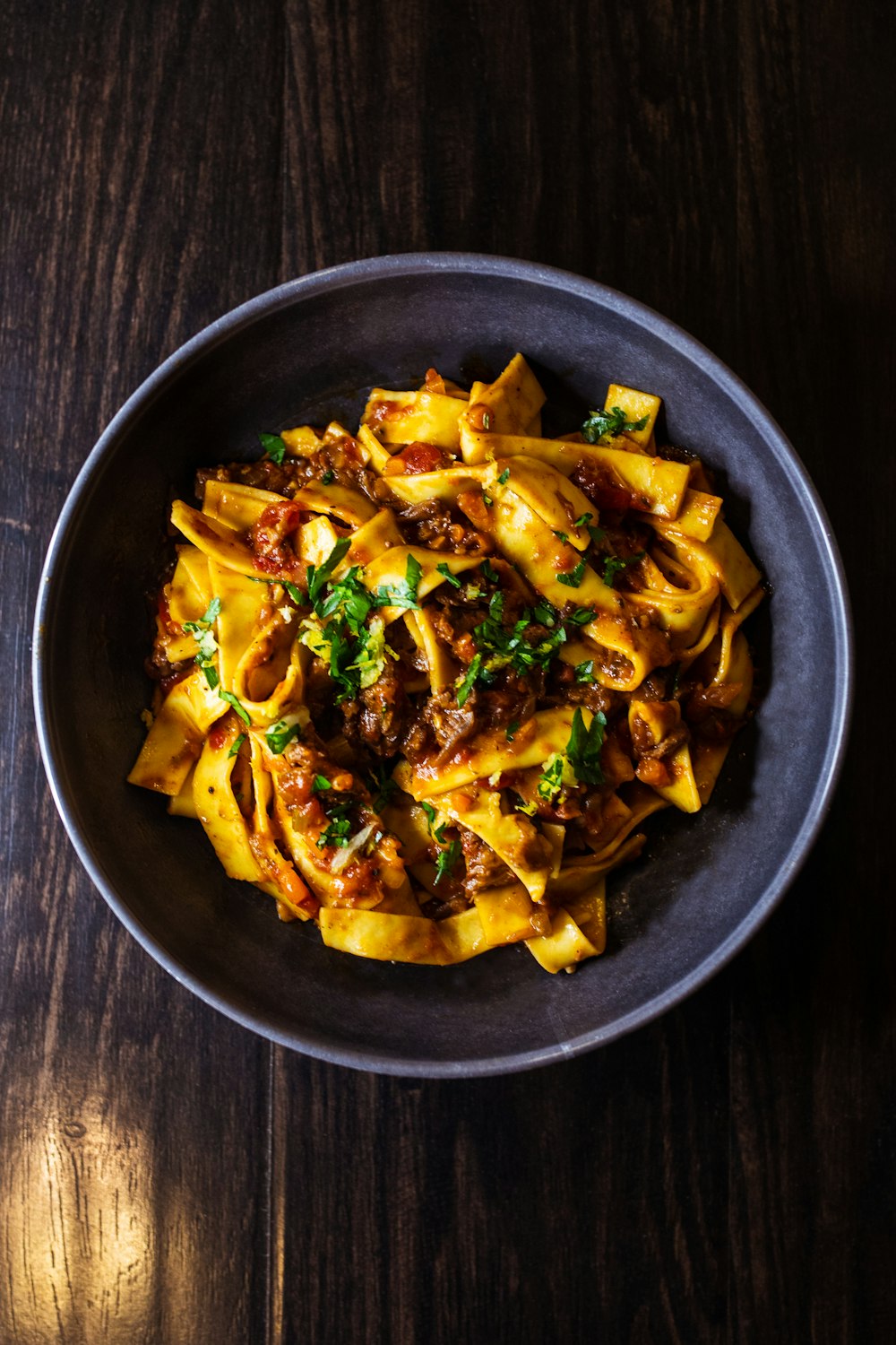 pasta dish on black ceramic bowl