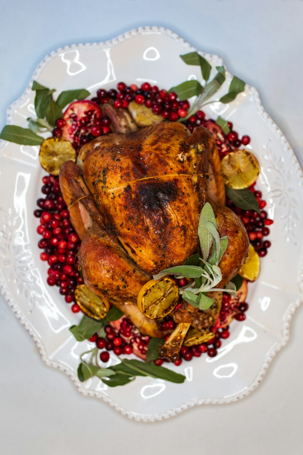 cooked food on white and red floral ceramic plate