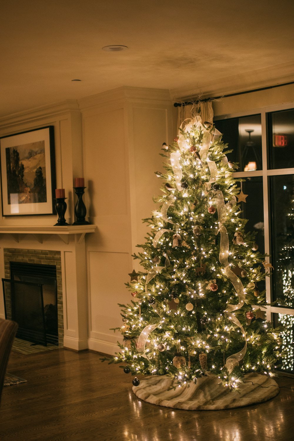 a lit christmas tree in a living room