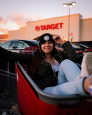 woman in black sunglasses sitting on red chair