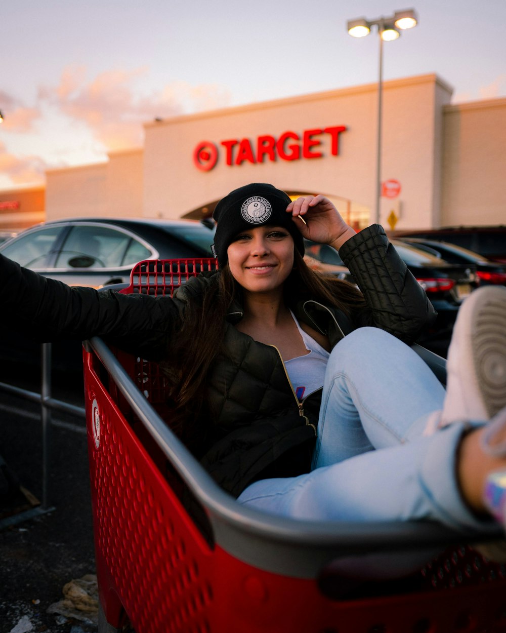 woman in black sunglasses sitting on red chair