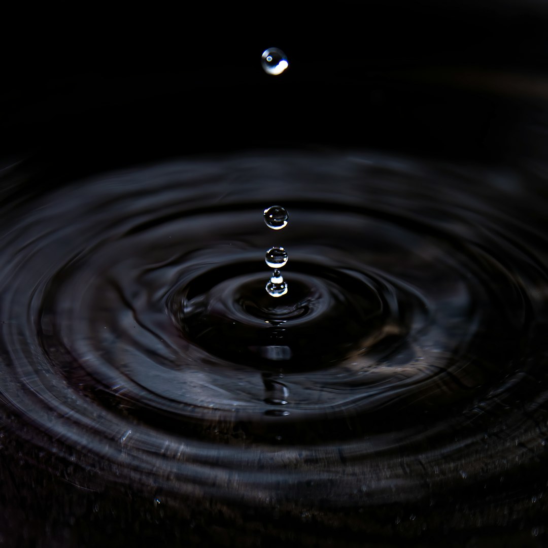 water drop on black surface