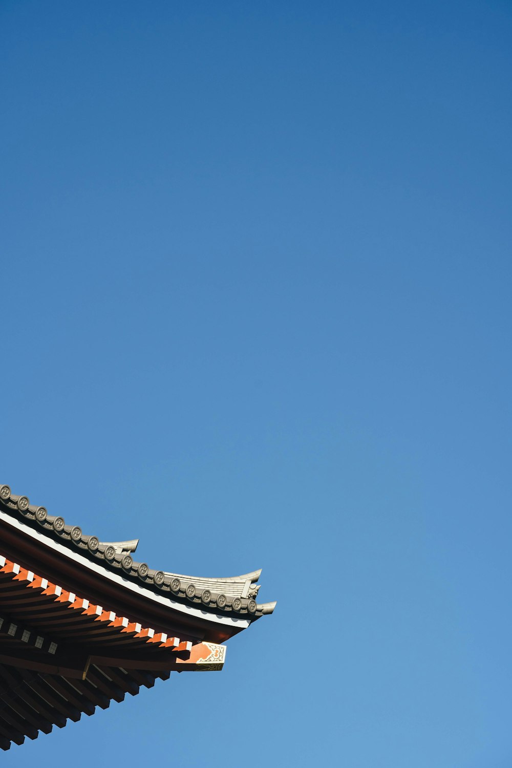 brown and white roof under blue sky during daytime