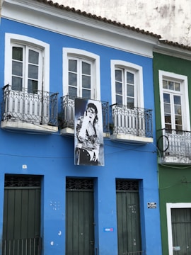 Exterior of a renovated commercial building with bold blue and white paint.