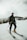 man in black jacket and black pants riding on red and white ski blades on snow