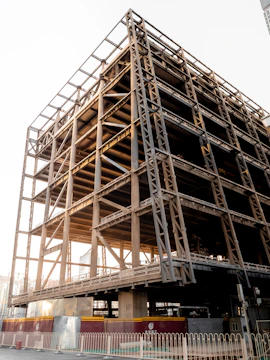 Close-up of steel framework rising on a sunny construction site.
