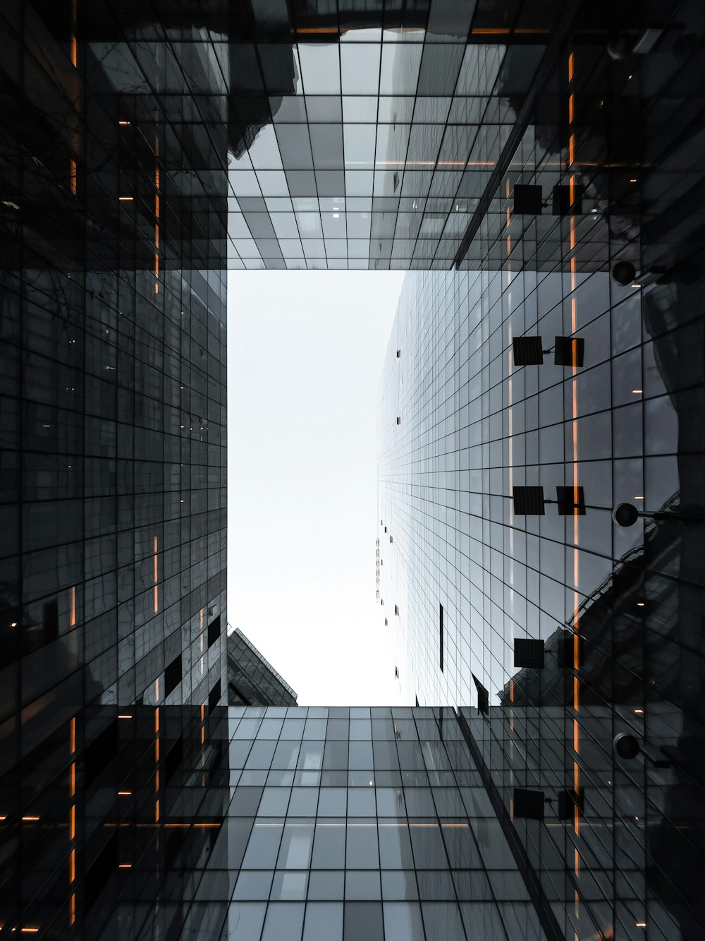 black and white glass walled high rise building