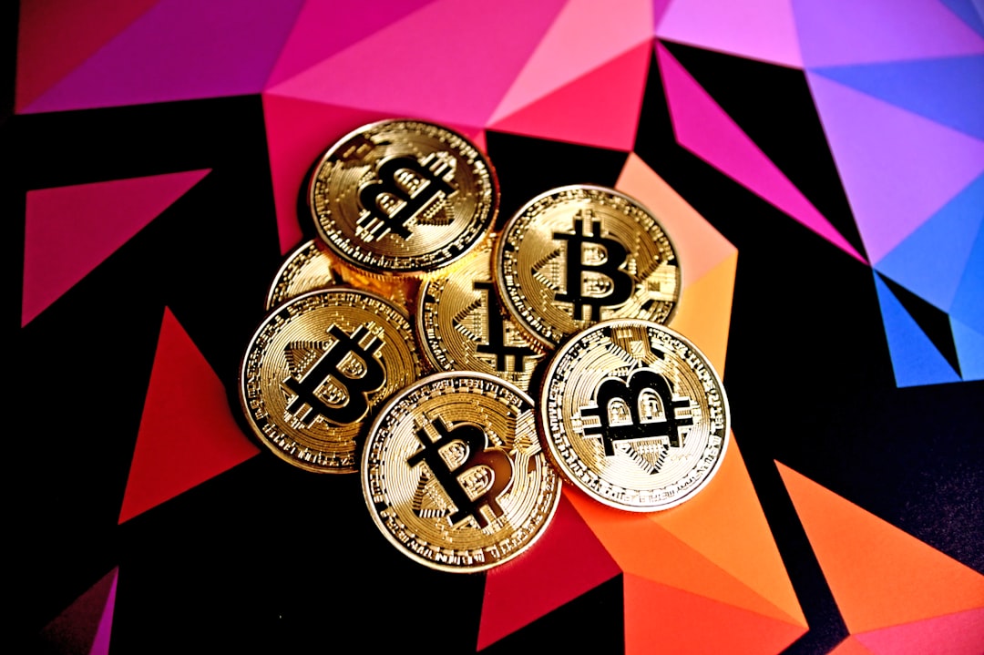 Bitcoins on a multi-colored background.