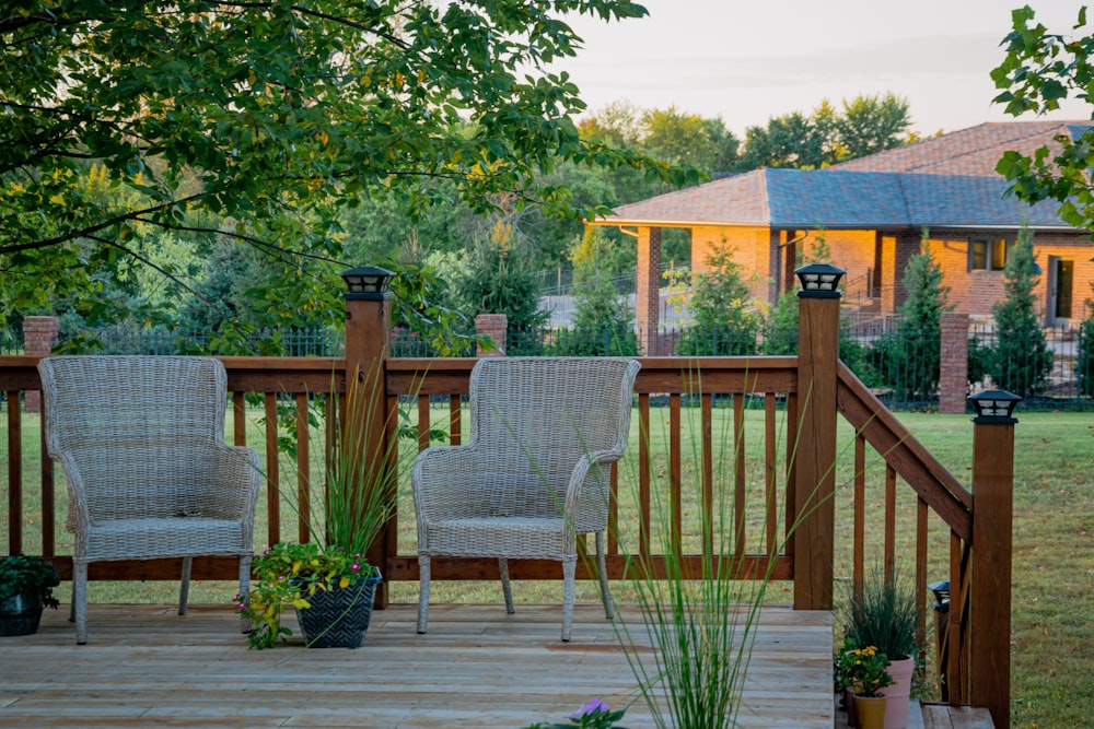 brown wooden fence near green trees during daytime