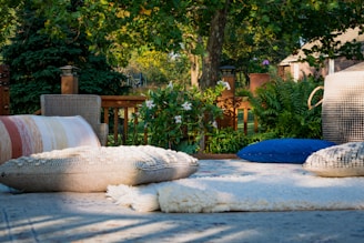 blue swimming pool near brown wooden fence during daytime