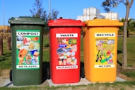 red yellow and green trash bins