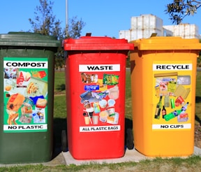 red yellow and green trash bins