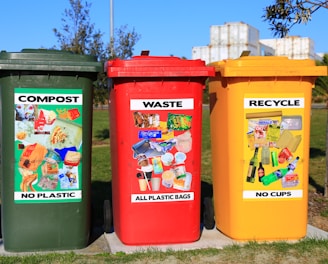 red yellow and green trash bins