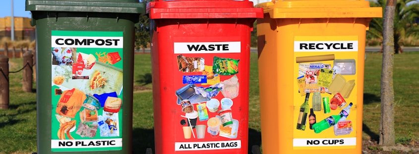 red yellow and green trash bins