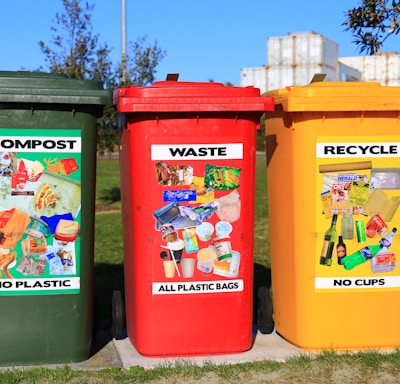 red yellow and green trash bins