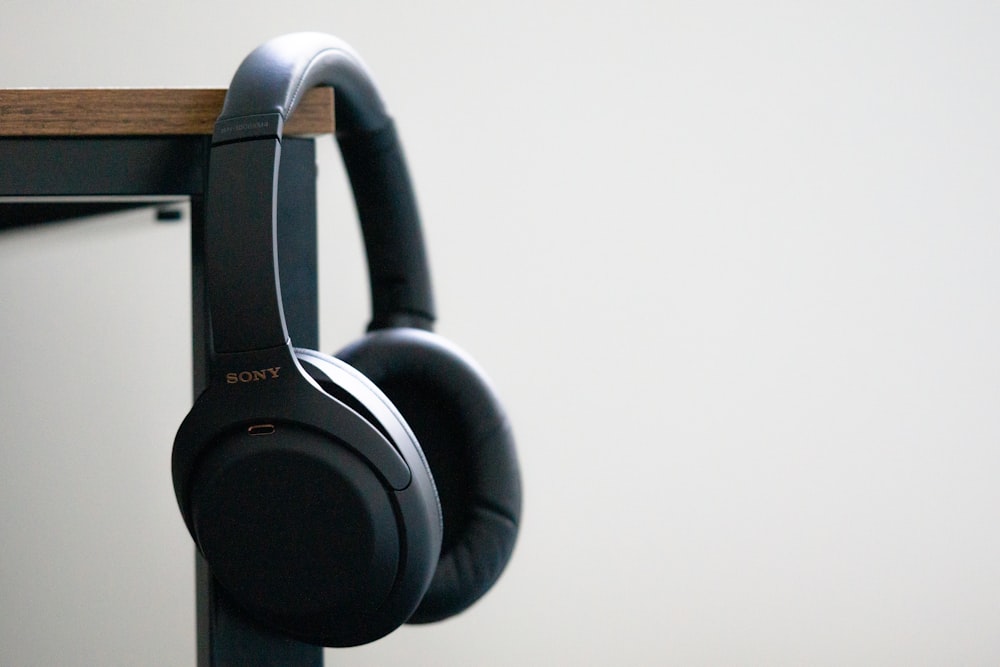 black and gray corded headphones