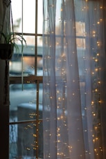 white and blue window curtain