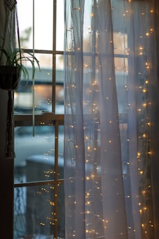 white and blue window curtain