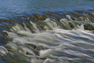 water waves on gray rocks