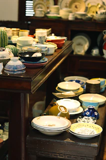 white and blue floral ceramic bowls on brown wooden table