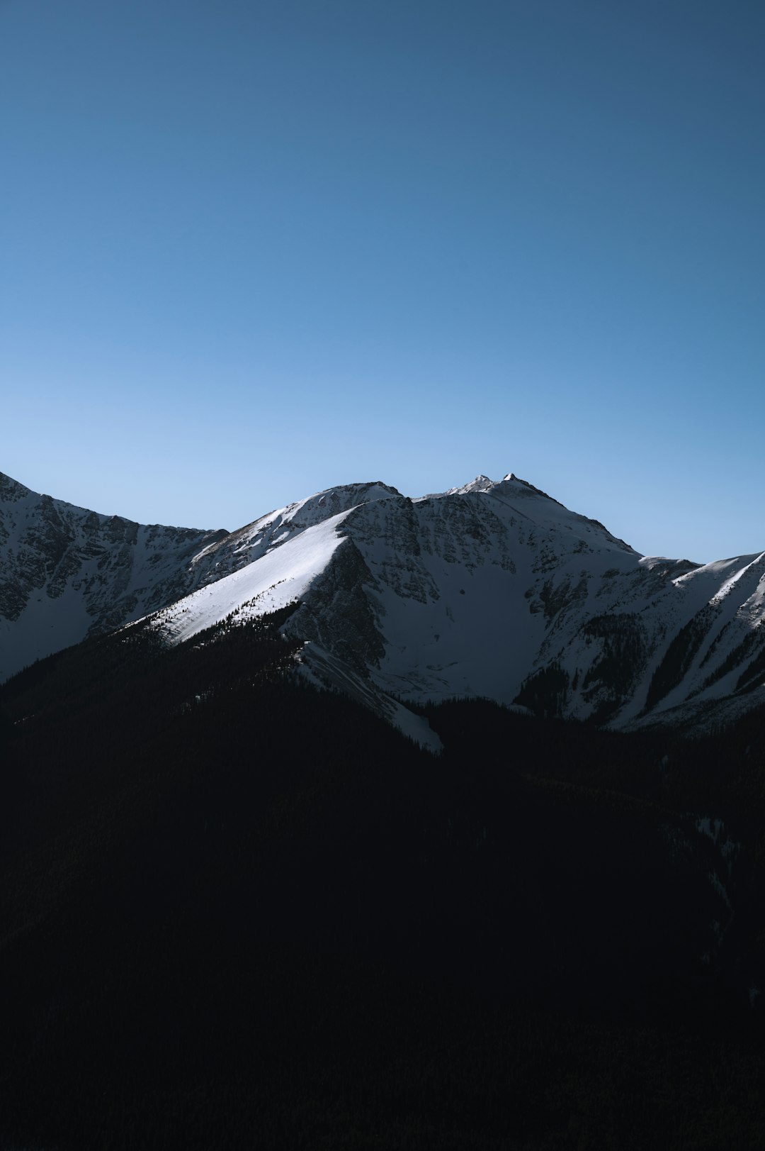 snow covered mountain under blue sky during daytime