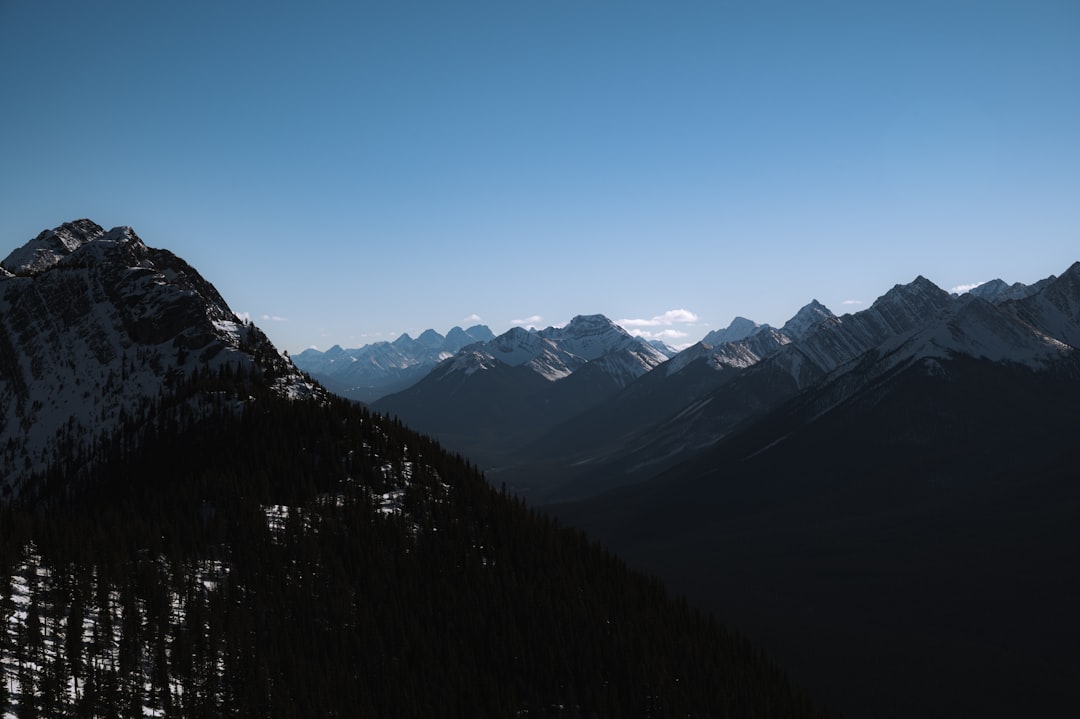 black and white mountains under blue sky during daytime