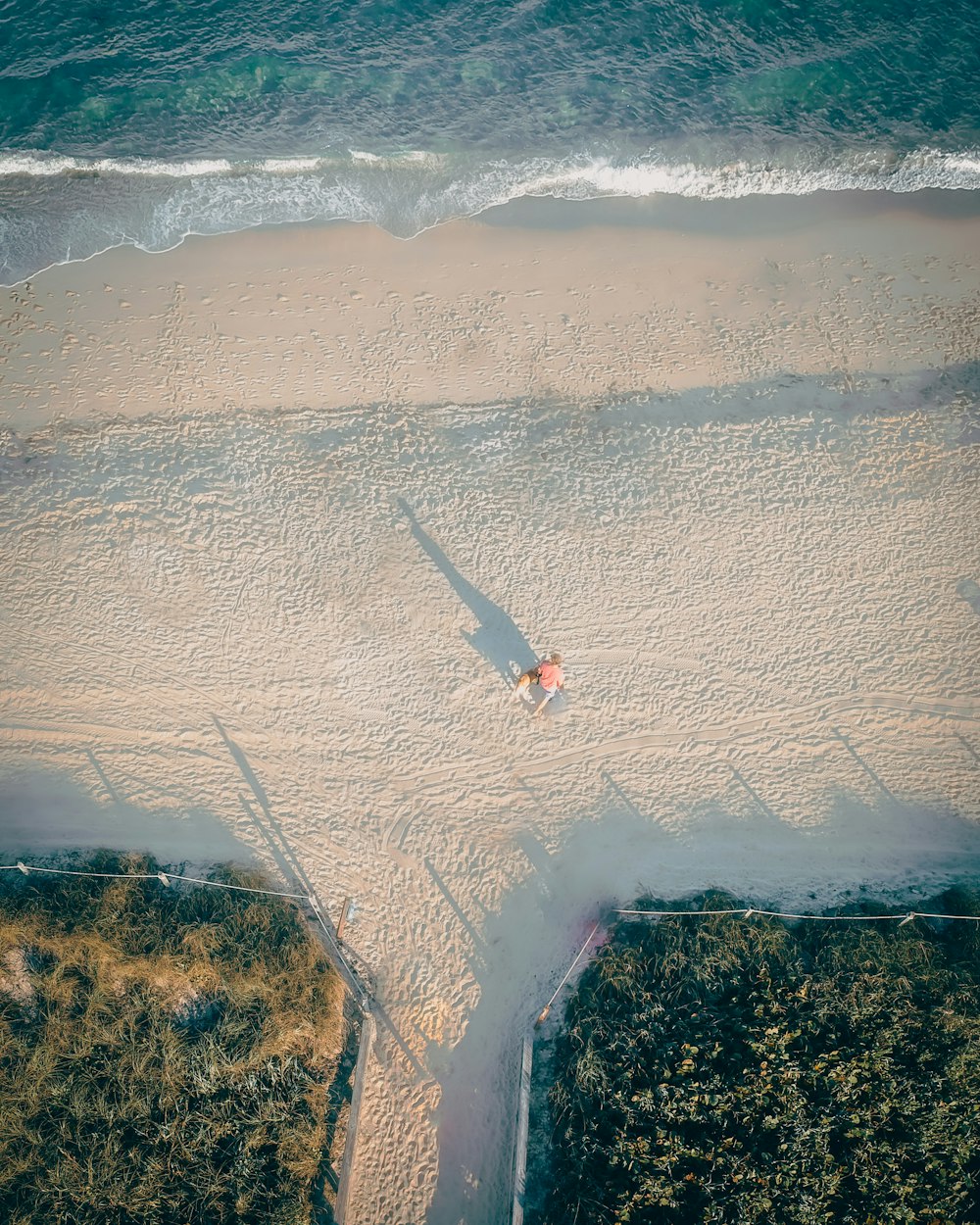 aerial view of person surfing on sea waves during daytime