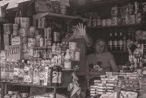 A family member serving customers inside the store.