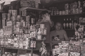 Image showing a friendly shopkeeper arranging products with care.
