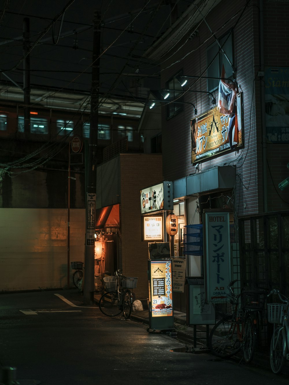 black motorcycle parked beside store during night time