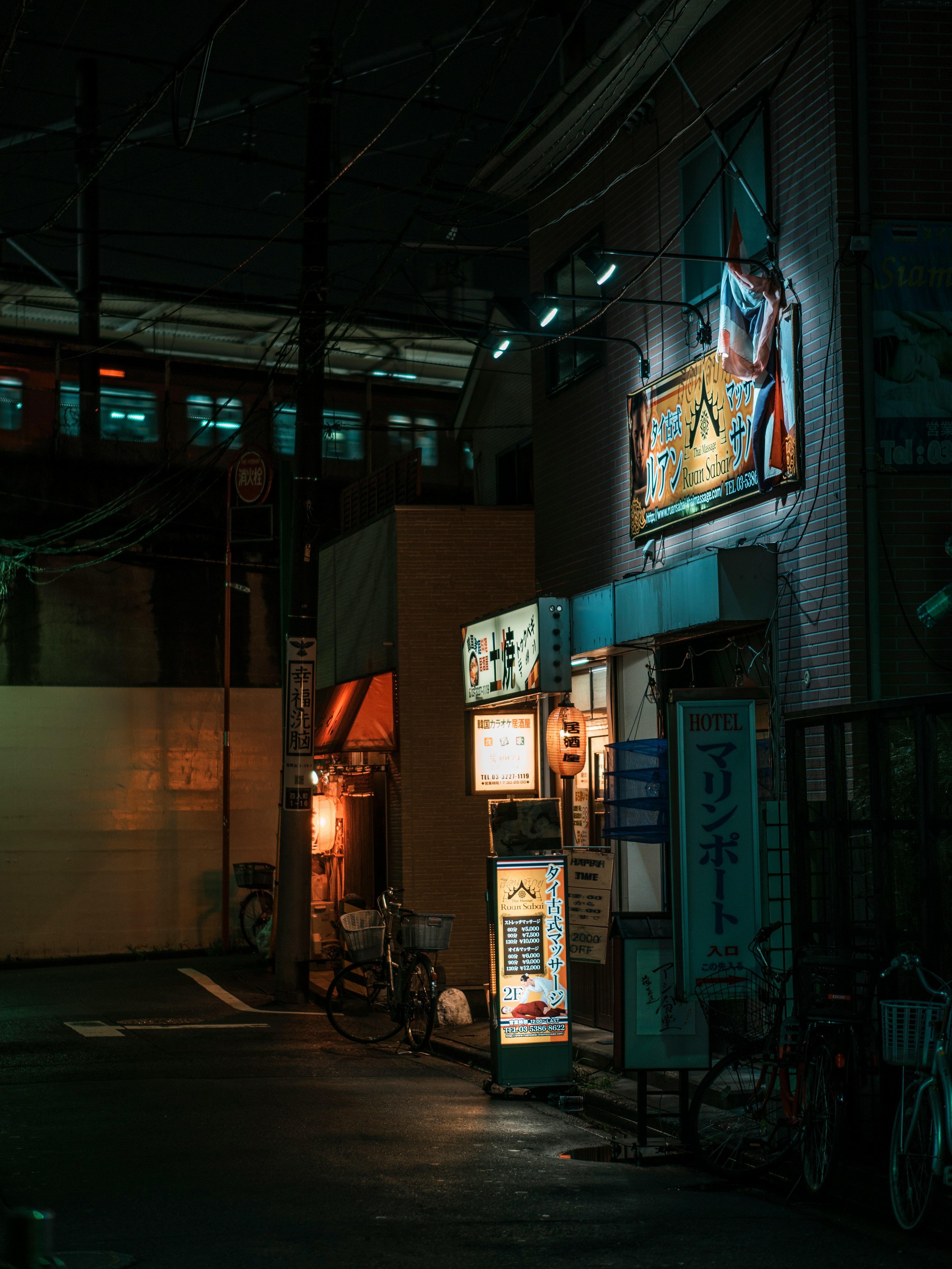 black motorcycle parked beside store during night time