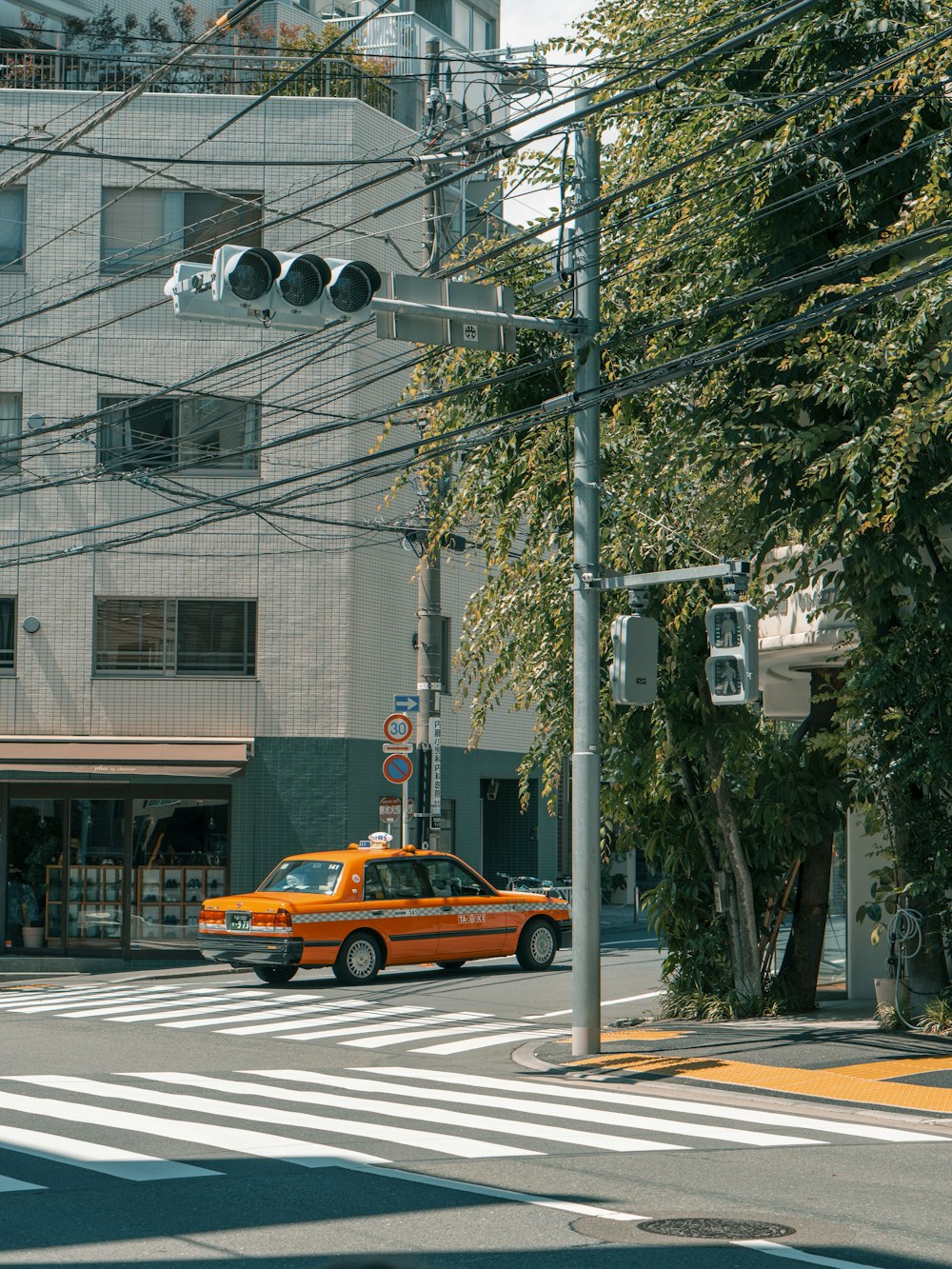 yellow cab on road during daytime