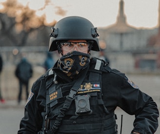 man in black police uniform wearing helmet