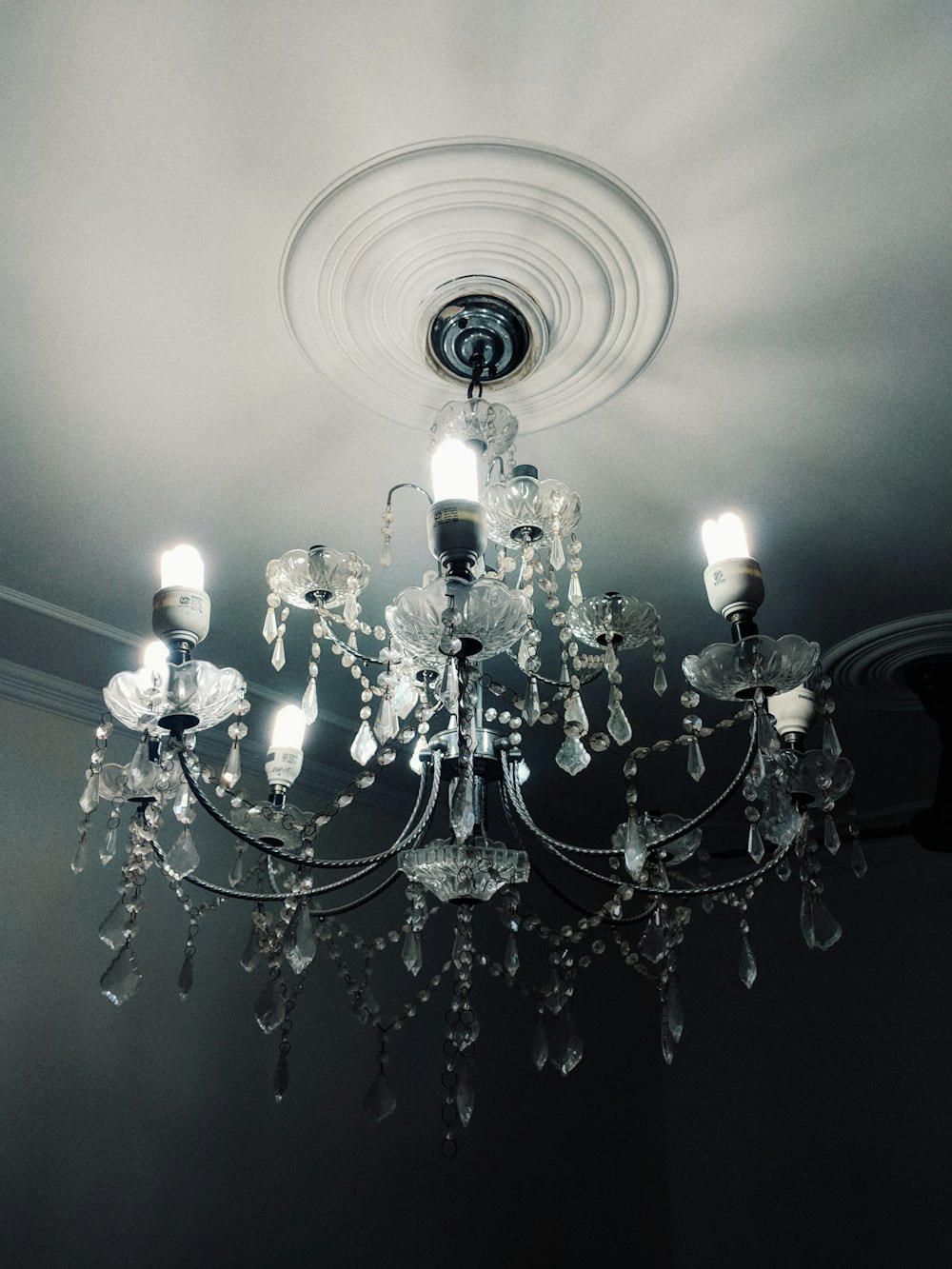silver and white uplight chandelier