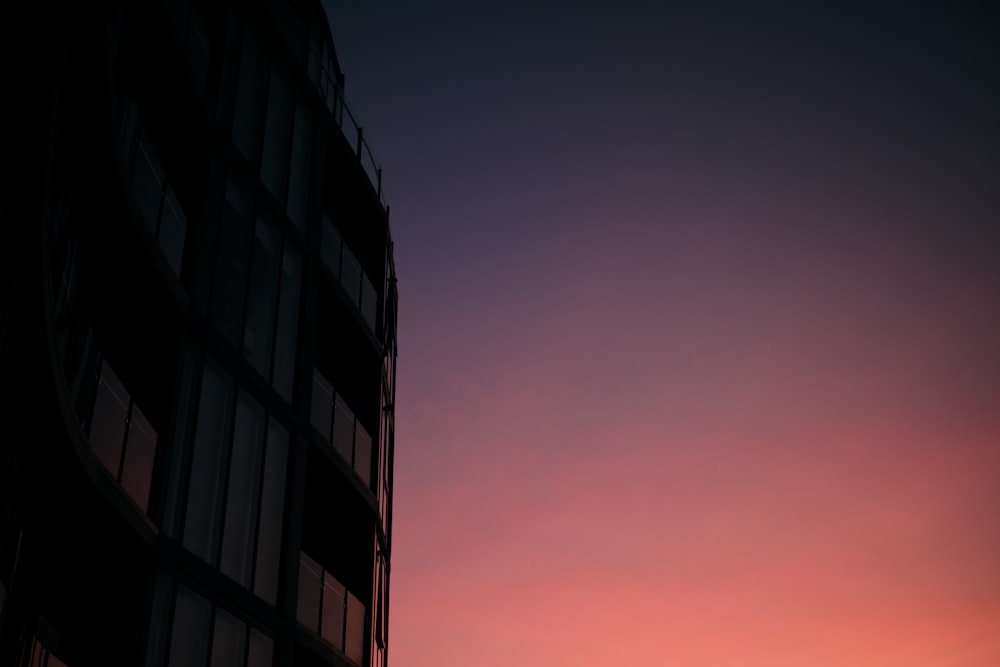 black concrete building during sunset