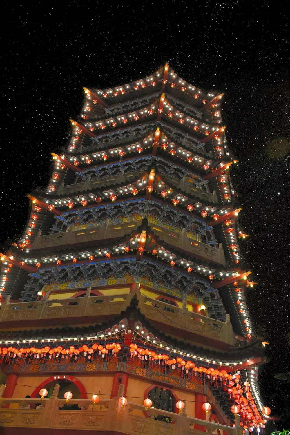 brown and red temple during night time