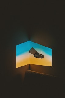 black flat screen tv turned on displaying blue screen