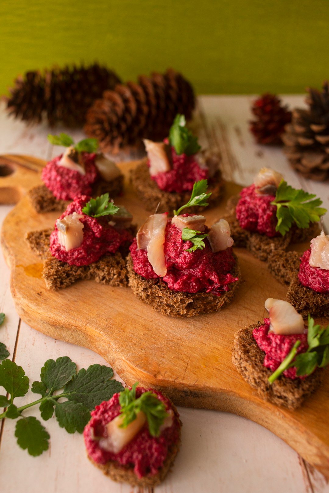 sliced bread with pink and white flowers on brown wooden chopping board