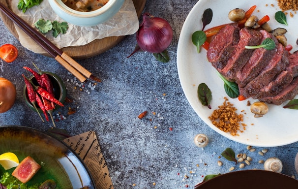 sliced meat on white ceramic plate