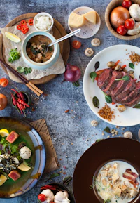 A colorful flat lay of fresh ingredients and stylish kitchen tools.