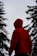 person in red hoodie standing on snow covered ground