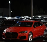 red bmw m 3 parked on parking lot during daytime