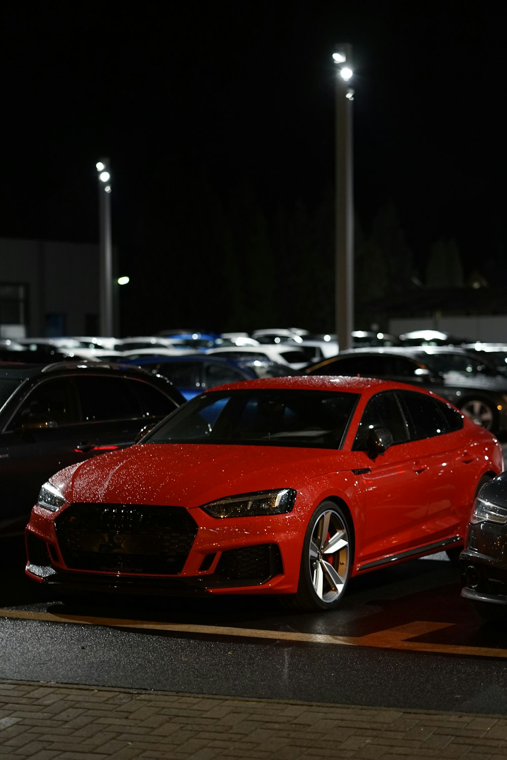 red bmw m 3 parked on parking lot during daytime