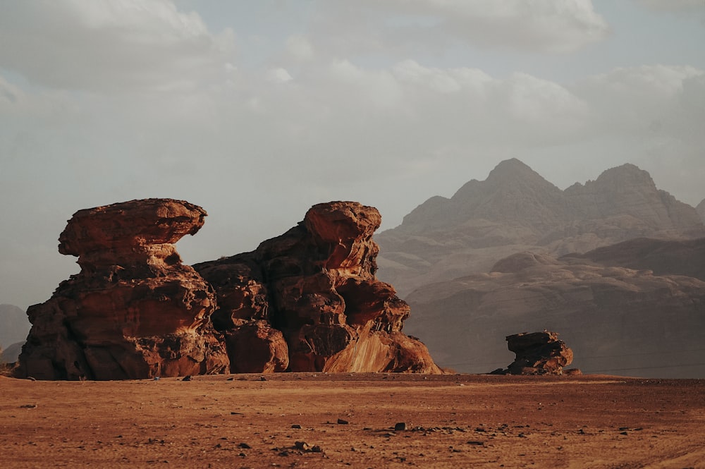 brown rock formation under white sky during daytime