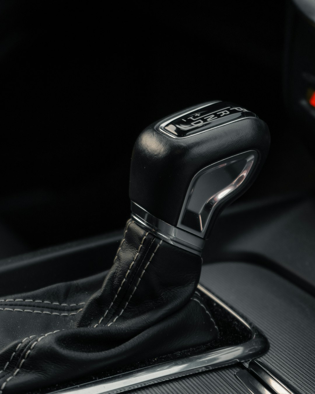 black and silver honda car gear shift lever